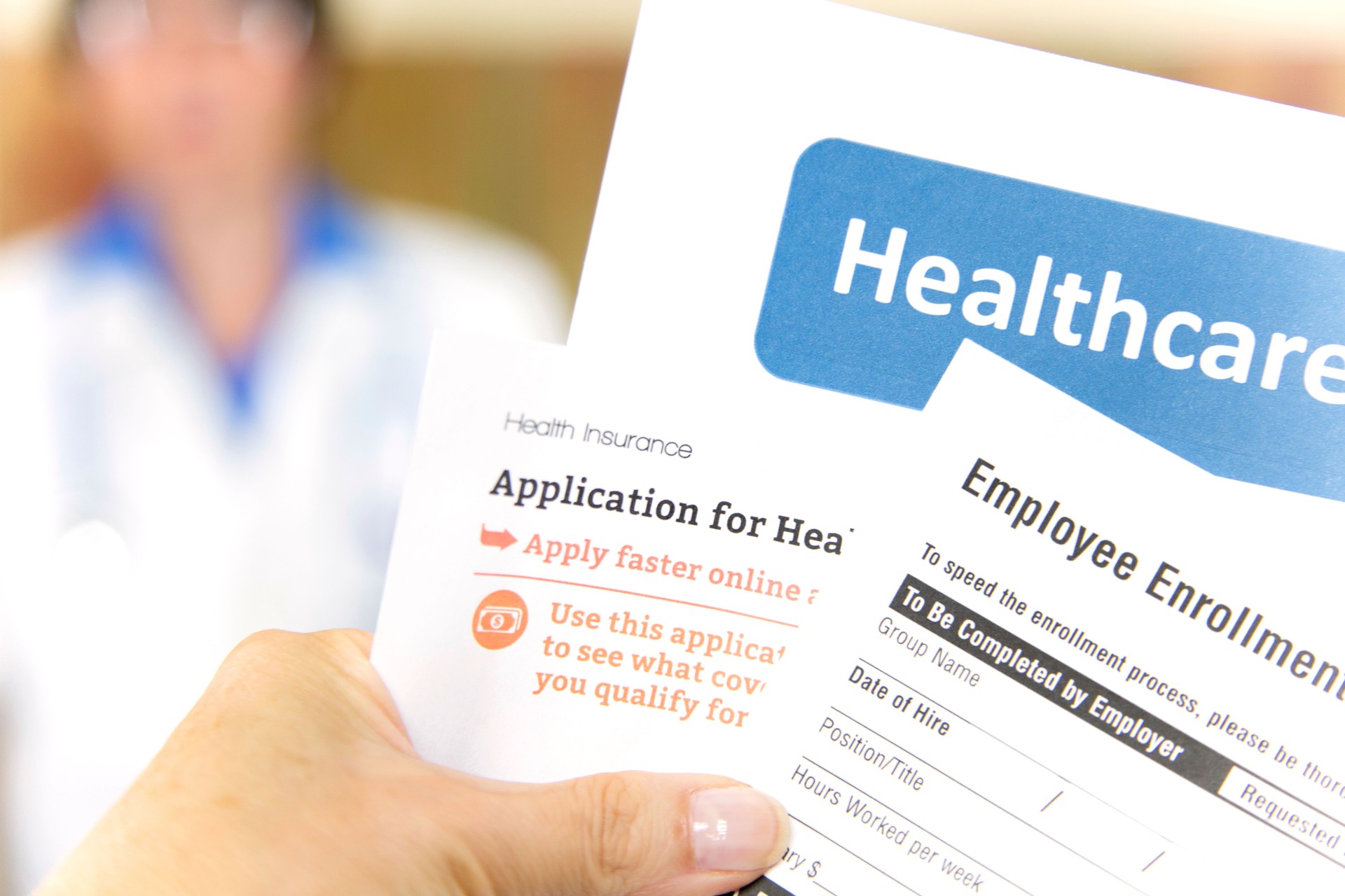 Open enrollment healthcare forms and medical doctor.